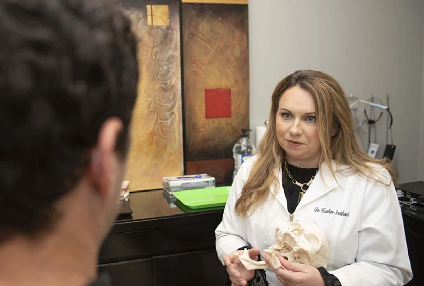 Jonesboro dentist Dr. Southard talking with one of her patients