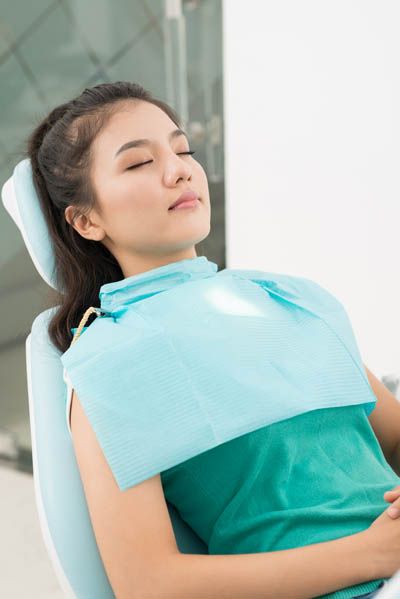 patient asleep for her oral surgery procedure