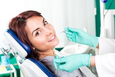 patient smiling during her gum disease treatment appointment at Southard Family Dentistry