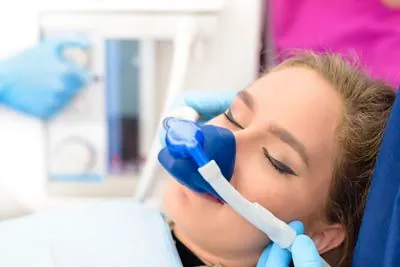 patient sleeping during her procedure thanks to sedation dentistry