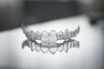 Clear aligner trays on a reflective surface
